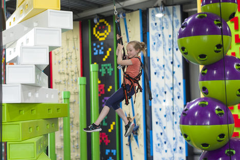A child having fun in the climbing paradise.