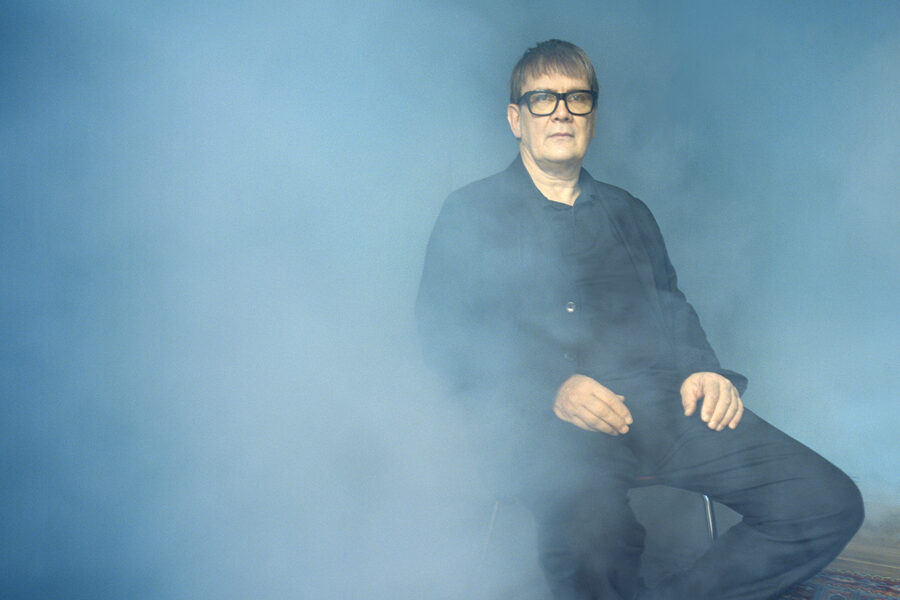 The author Sven Regener sitting in the fog