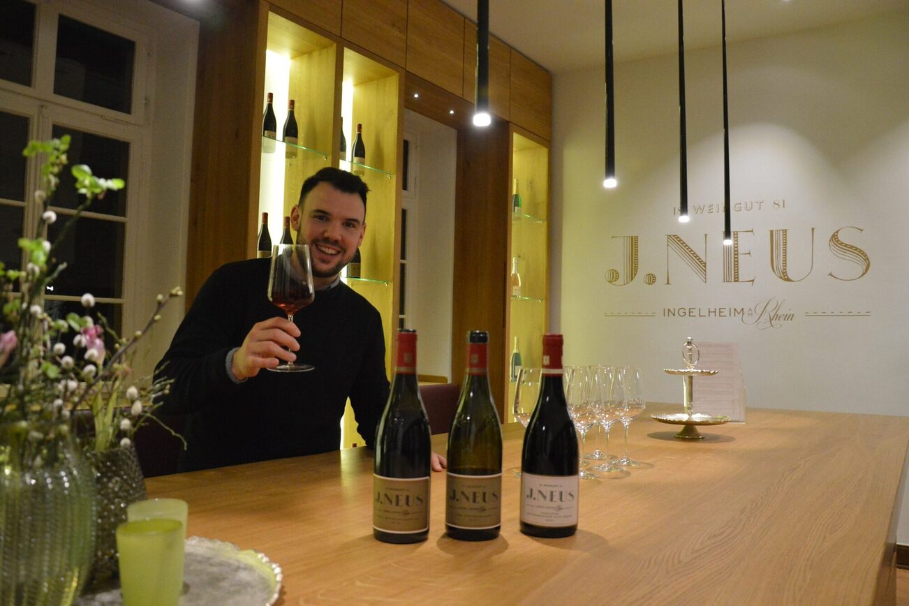 Winemaker Lewis Schmitt raises a glass of red wine.