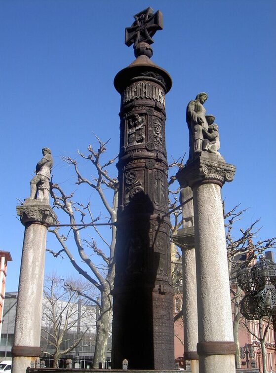 Nail column in front of a blue sky
