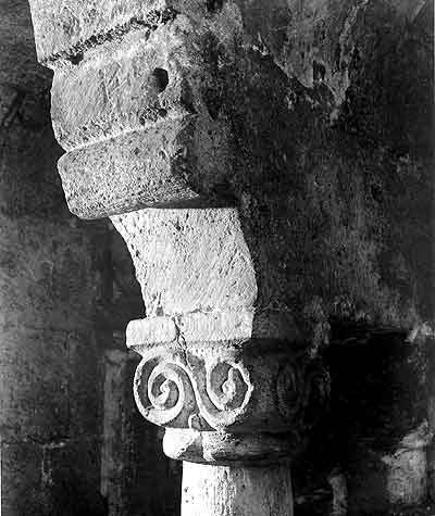 Scroll pattern on cube-shaped capital