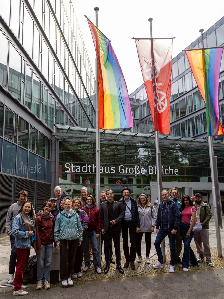 Lord Mayor Nino Haase with representatives of LGBTIQ+ at the raising of the rainbow flag