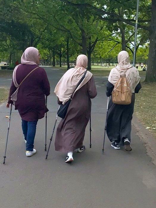 Zakia Amallah, exercise instructor and community nurse plus, with two participants from the intercultural running group for senior women