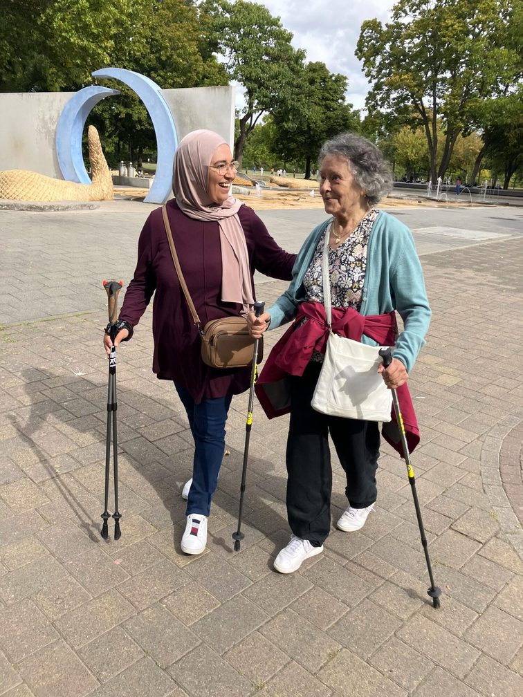 Community Nurse Plus, Zakia Amallah, with a participant in the intercultural running group for senior women