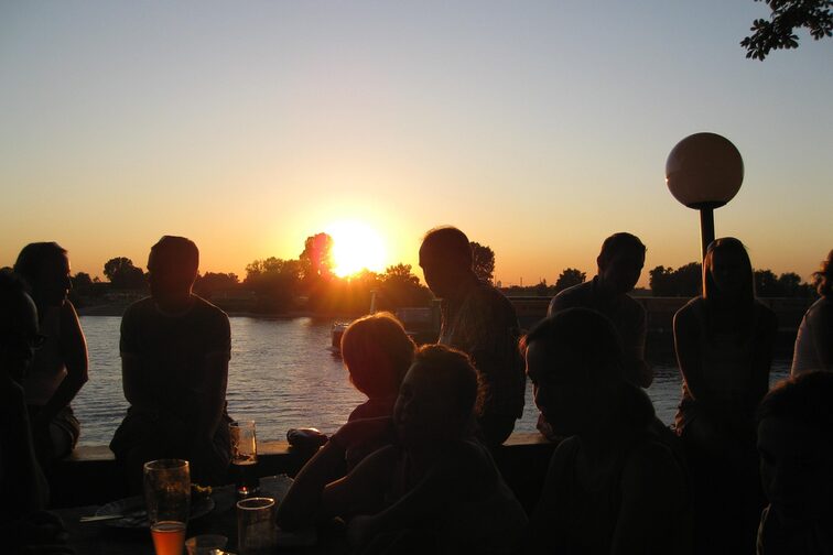 People in the beer garden on the riverbank