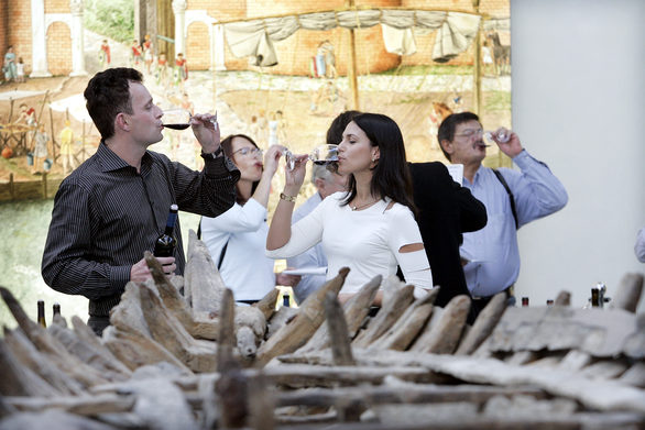 A couple taking part in a wine tasting.