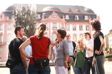 Tour guide explaining facts about the Carnival Fountain.