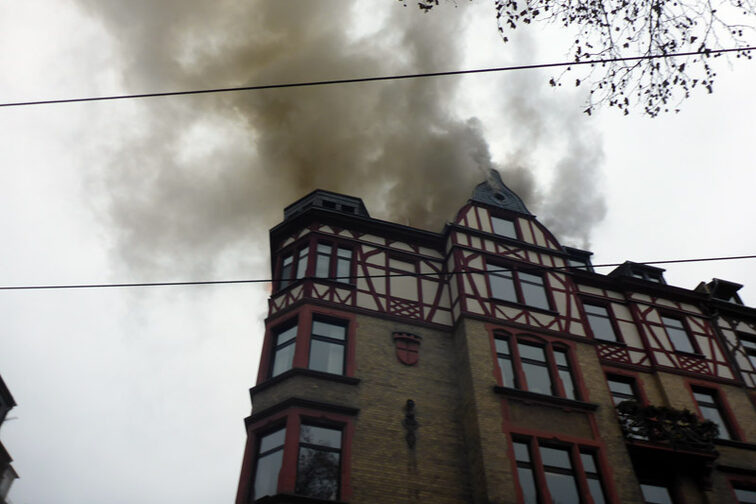 Smoke is coming out of the roof truss.